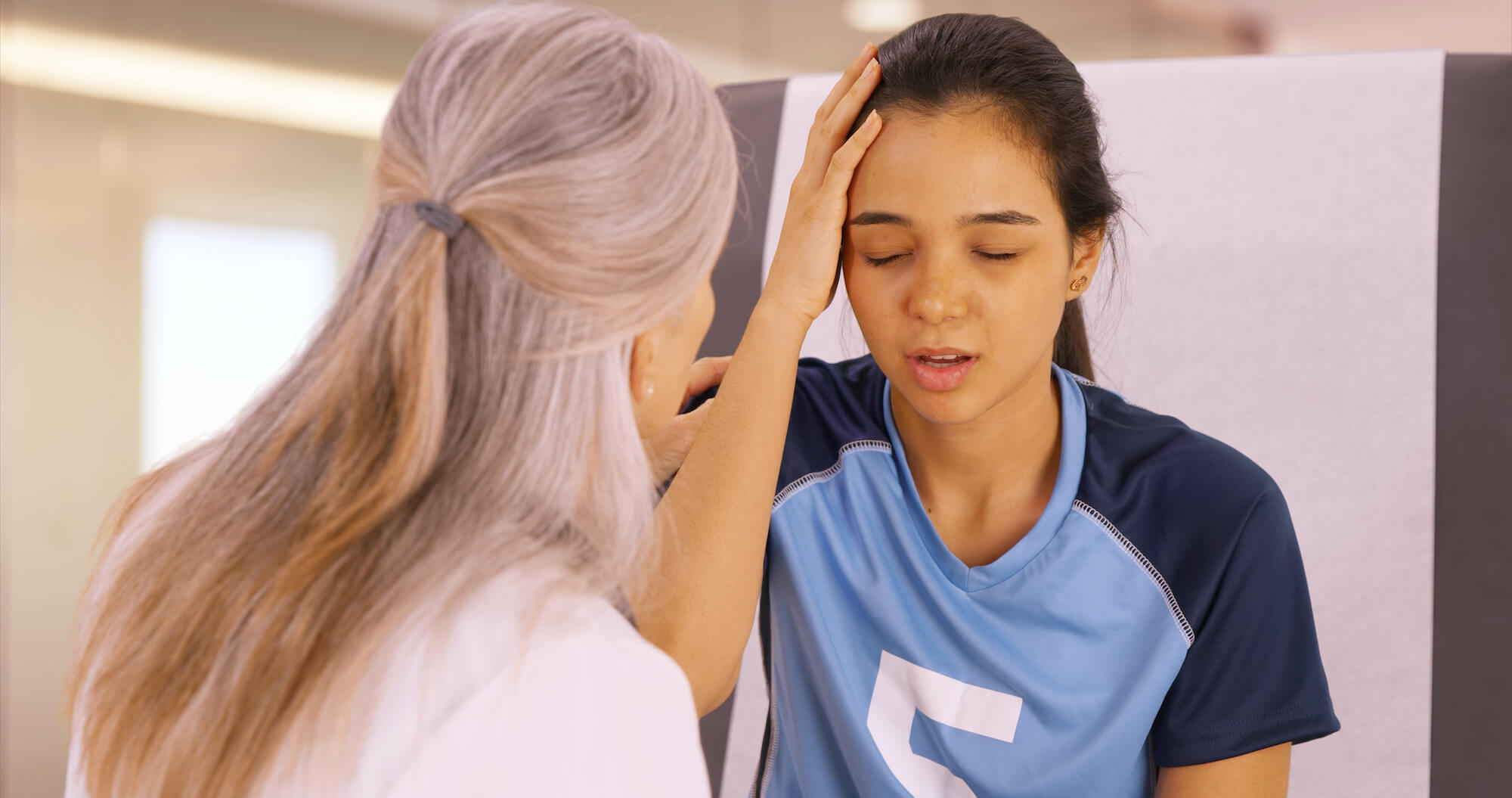 A concussed soccer player seeks help at the doctors office Know the signs of a concussion.